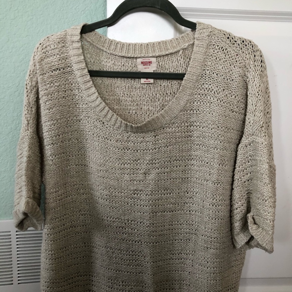 Woman’s short sleeved knit sweater